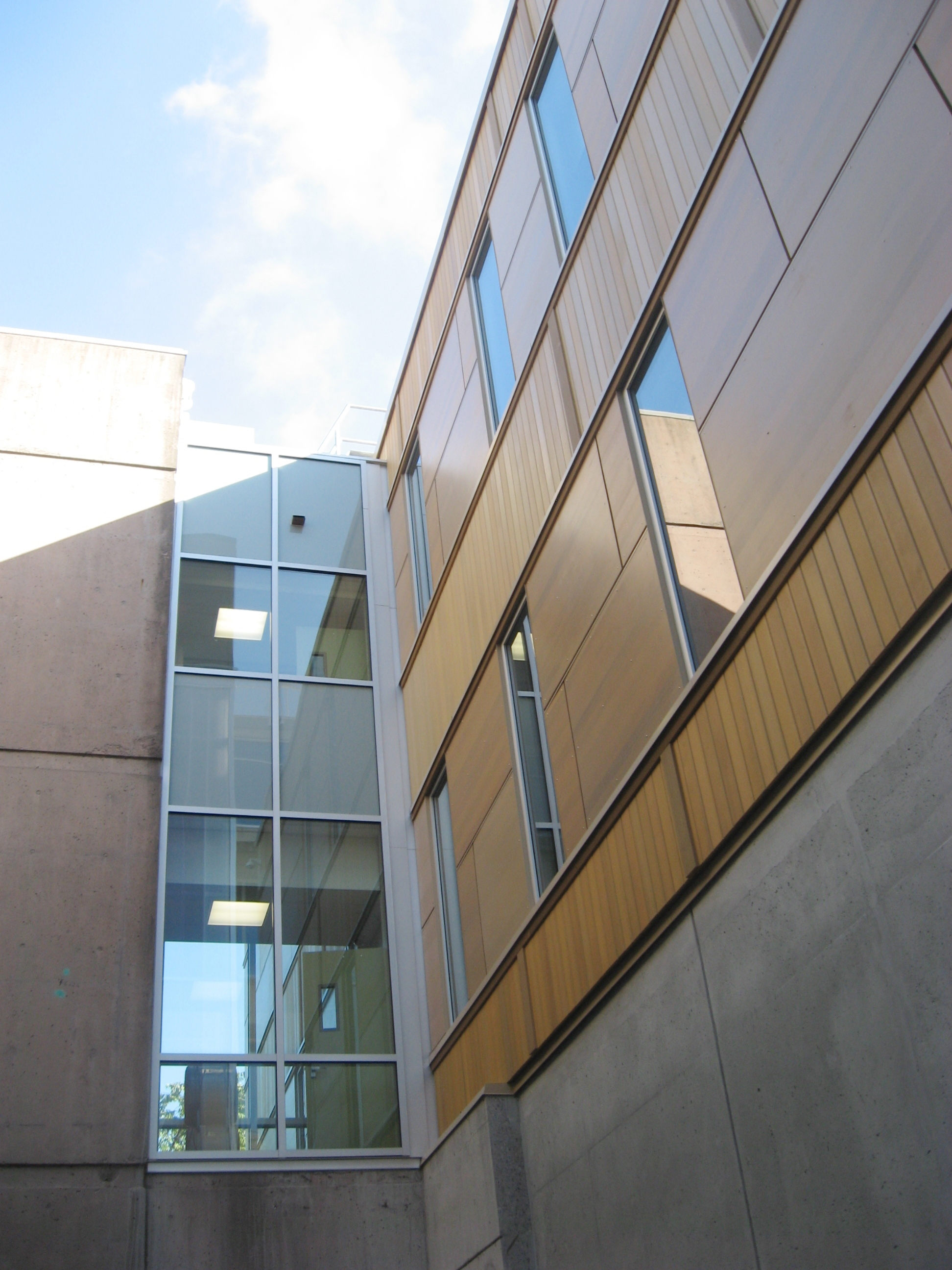 Close up of building exterior showing connecting bridge