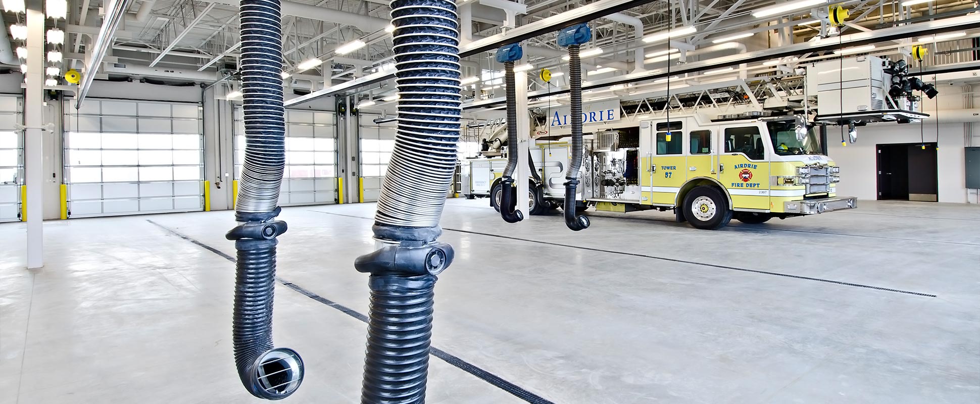 Interior of Airdrie Main Fire Hall showing fire truck and equipment