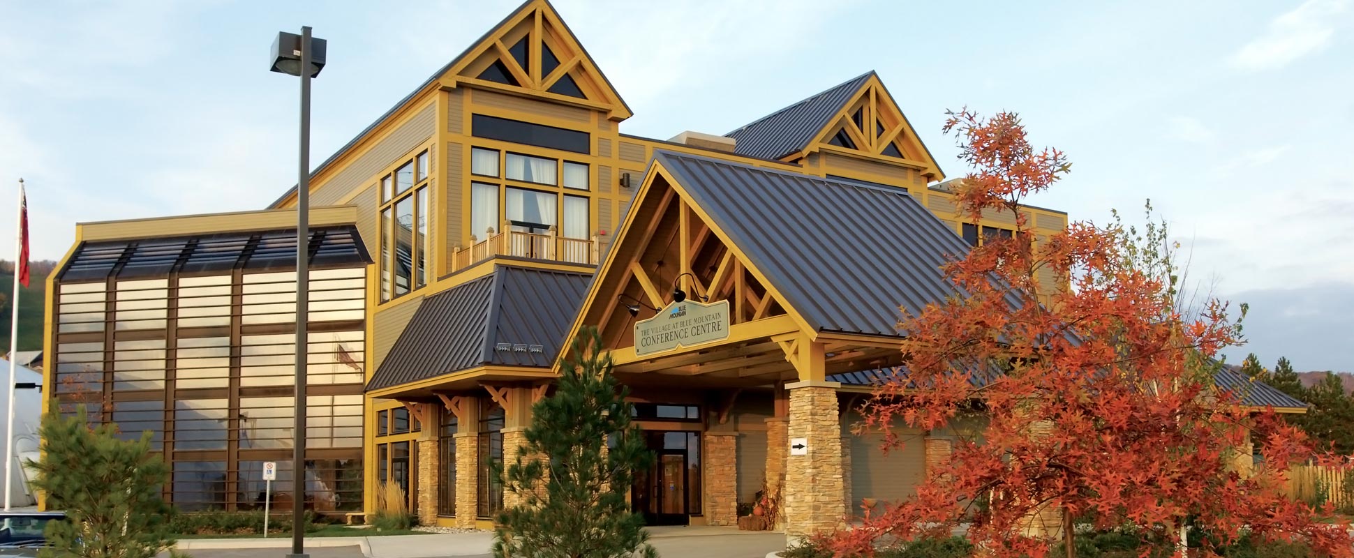Blue Mountain Conference Centre exterior showing entrance portico and trees in foreground