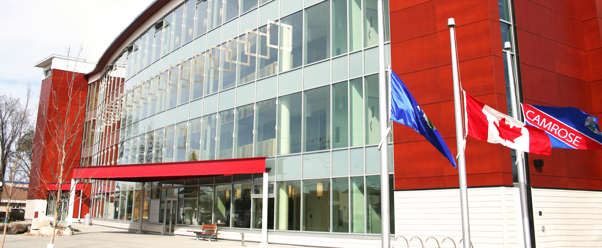 Camrose City Hall exterior showing entrance and flags