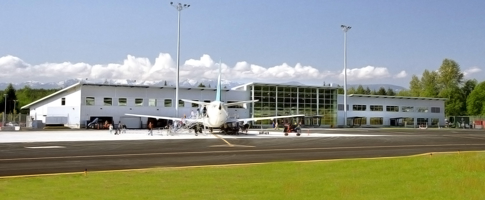 Comox Valley Airport with plane parked in foreground