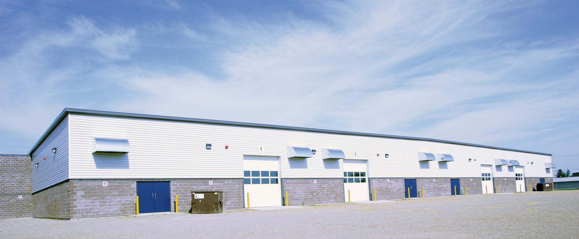 Keystone Centre Agriculture Centre of Excellence exterior showing bay doors