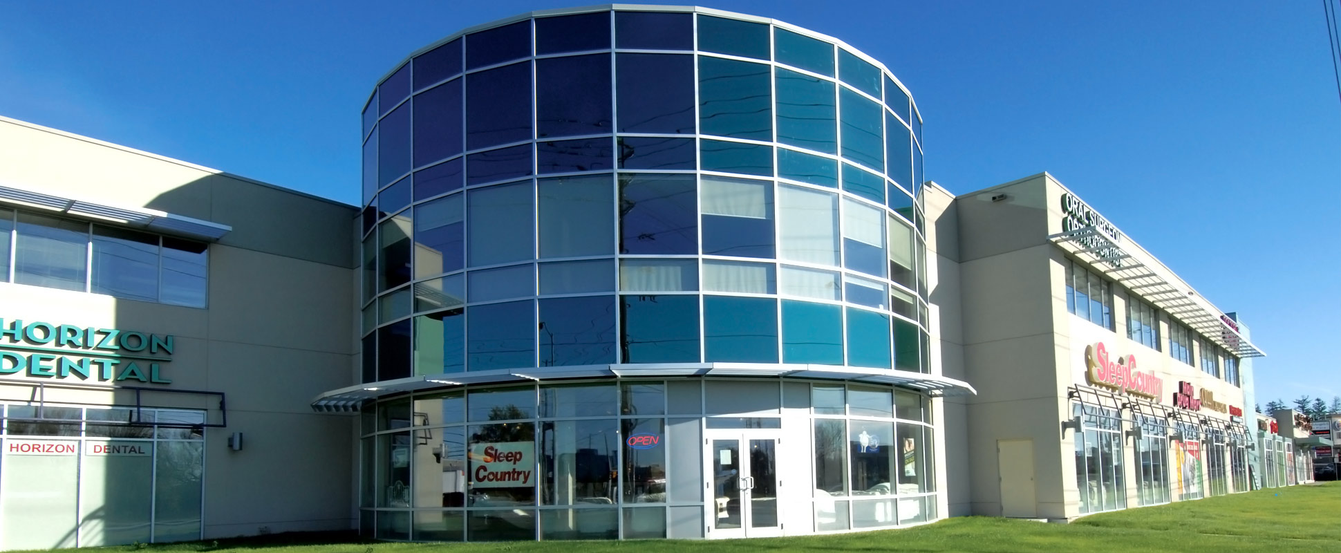 Michael-Angelo’s Market Place exterior showing tower with blue tinted glass facade 