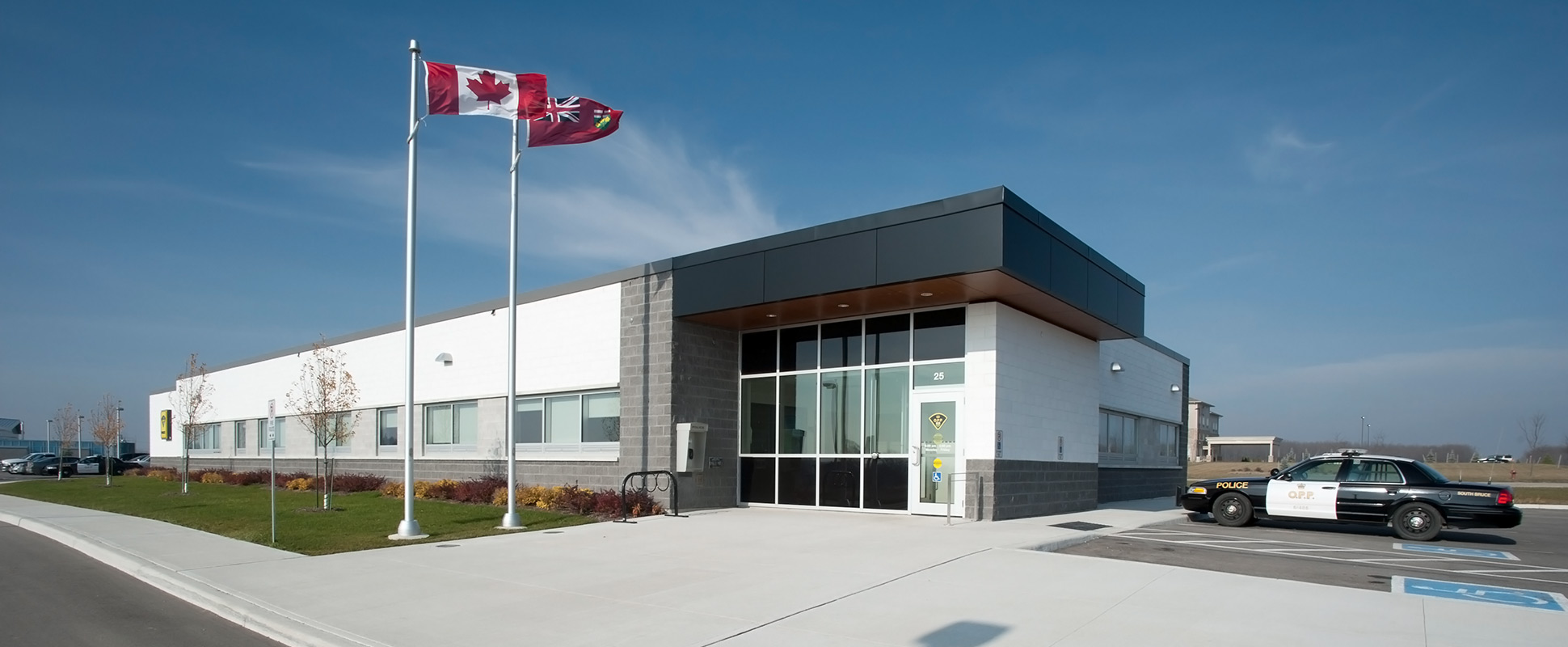 Exterior of police station with white and black cladding
