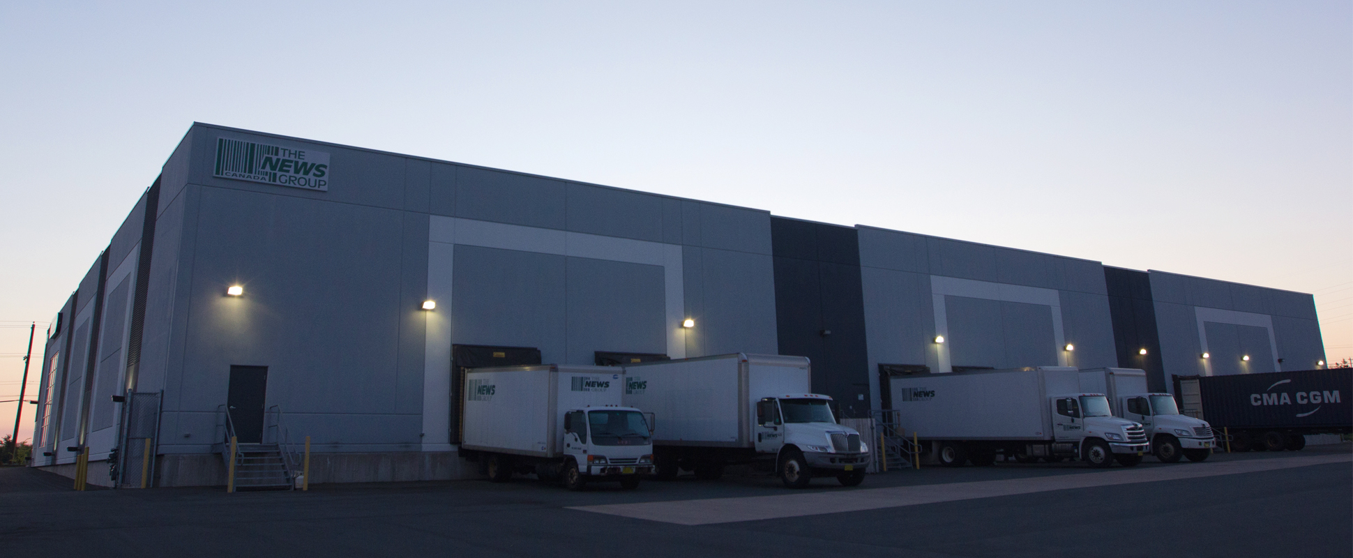 Pattison Outdoor Advertising Warehouse showing loading docks with trucks