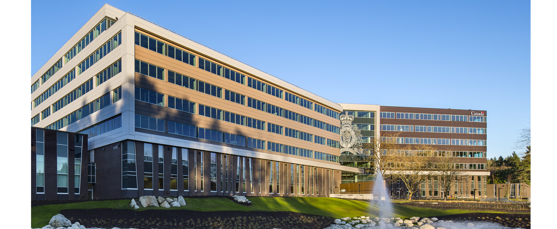 RCMP E Division exterior showing fountain in foreground 