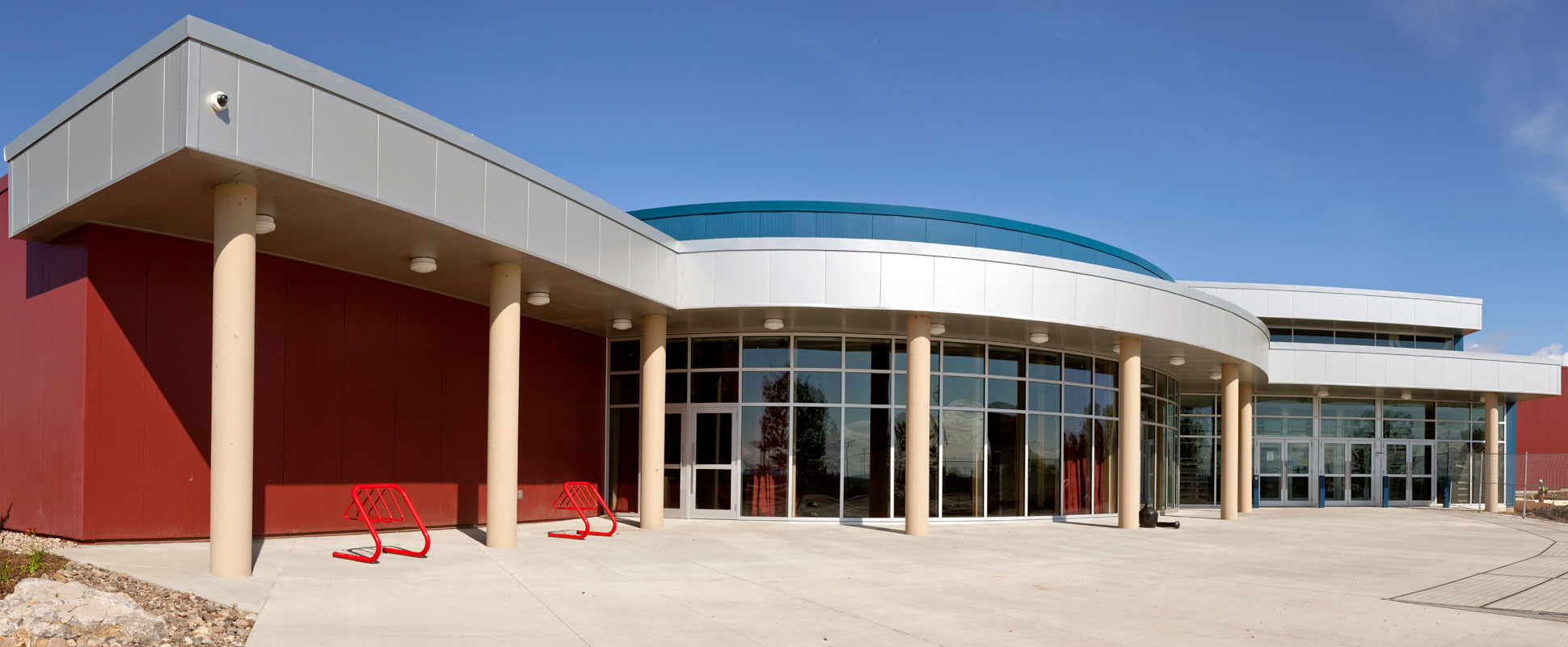 Northern Rockies Regional Recreational Centre exterior showing curved glass facade 