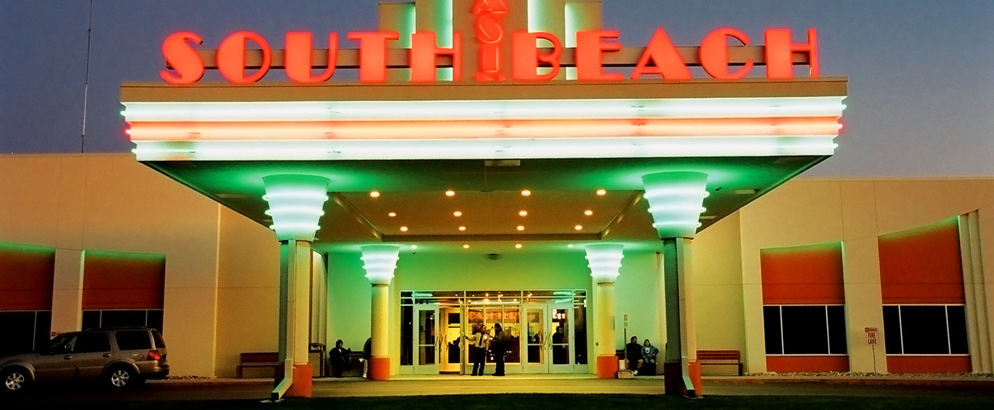 South Beach Casino front portico lit up with neon lights