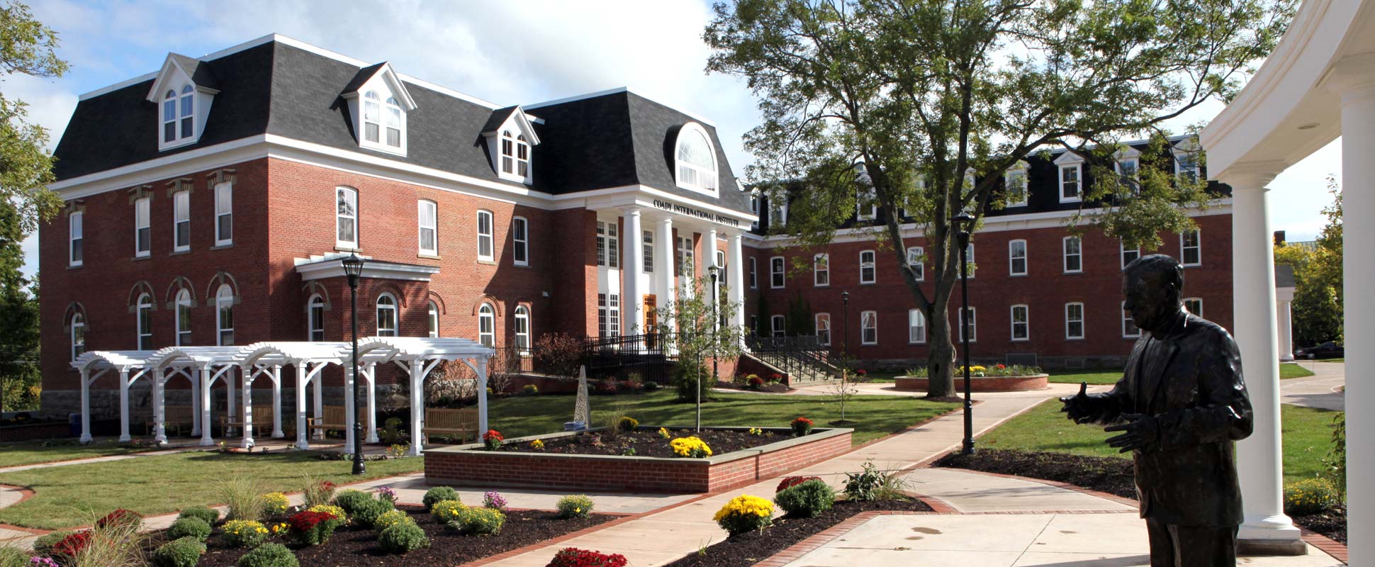 St. Francis Xavier Coady International Institute exterior showing buildings and landscaped gardens