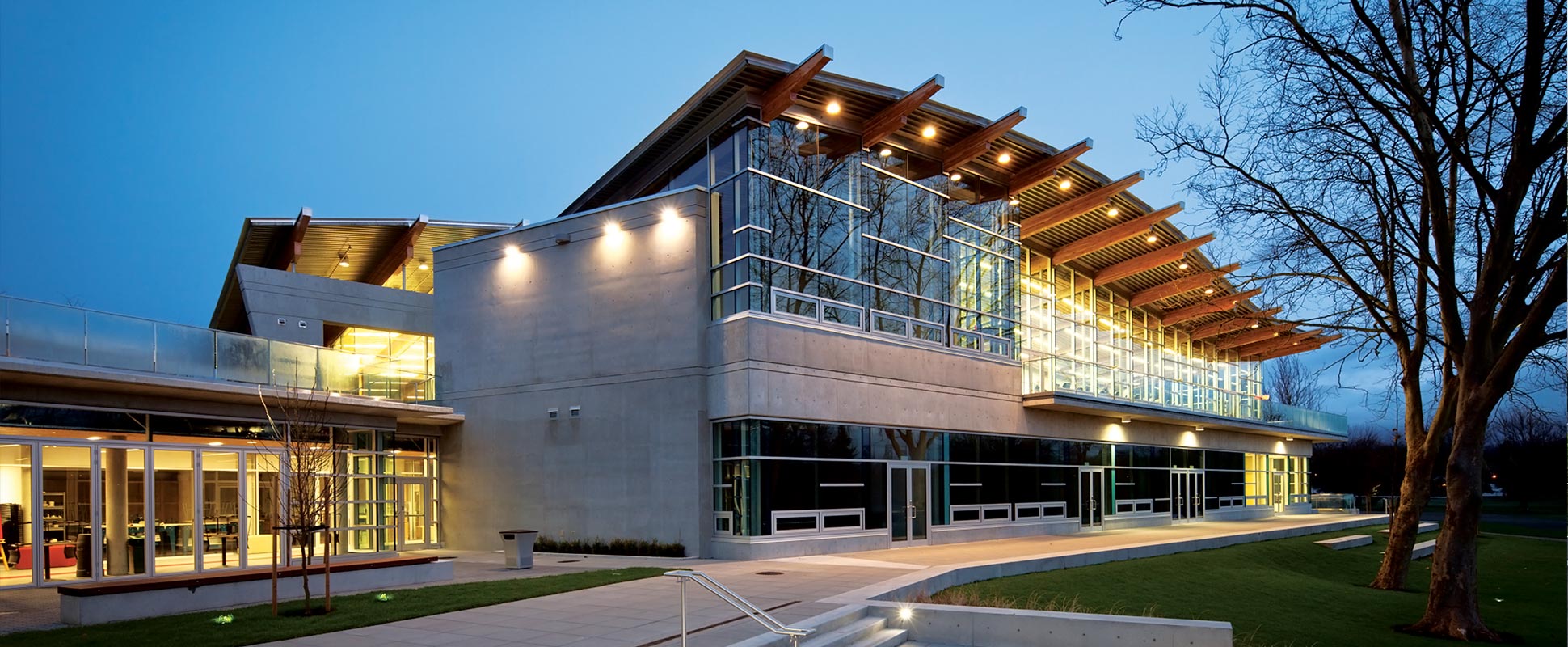 Exterior of the Trout Lake Arena lit up at night