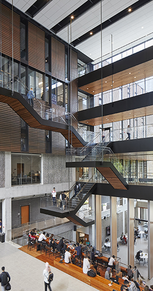 Interior of University building showing suspended walkways and seating areas