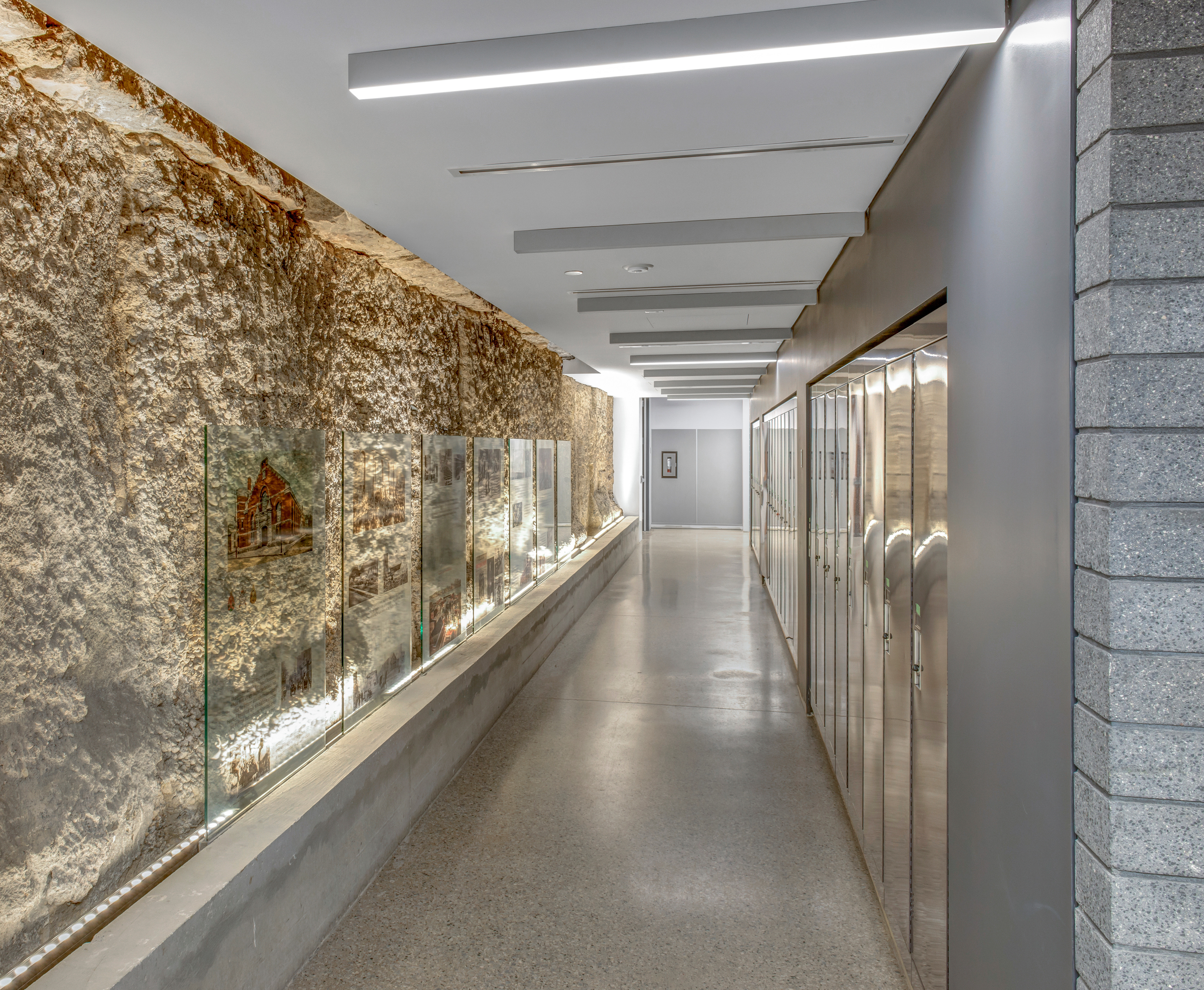 Interior of the Armouries building showing the hallway with exposed original wall